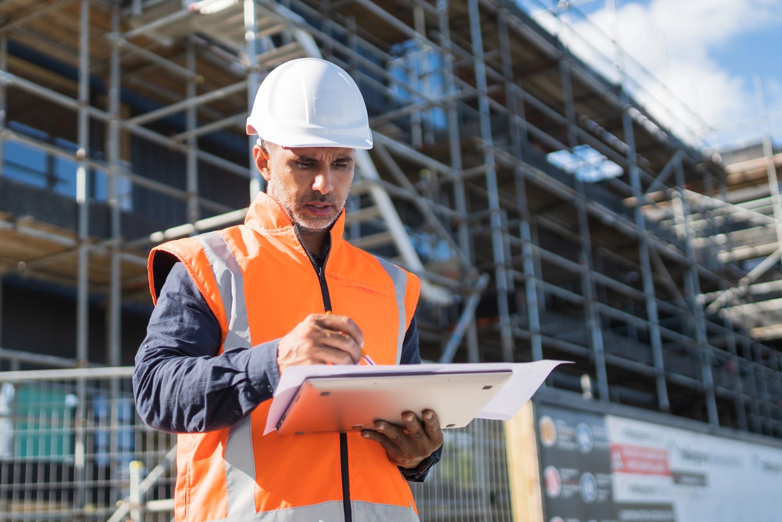 Project manager reviewing plans on a construction site