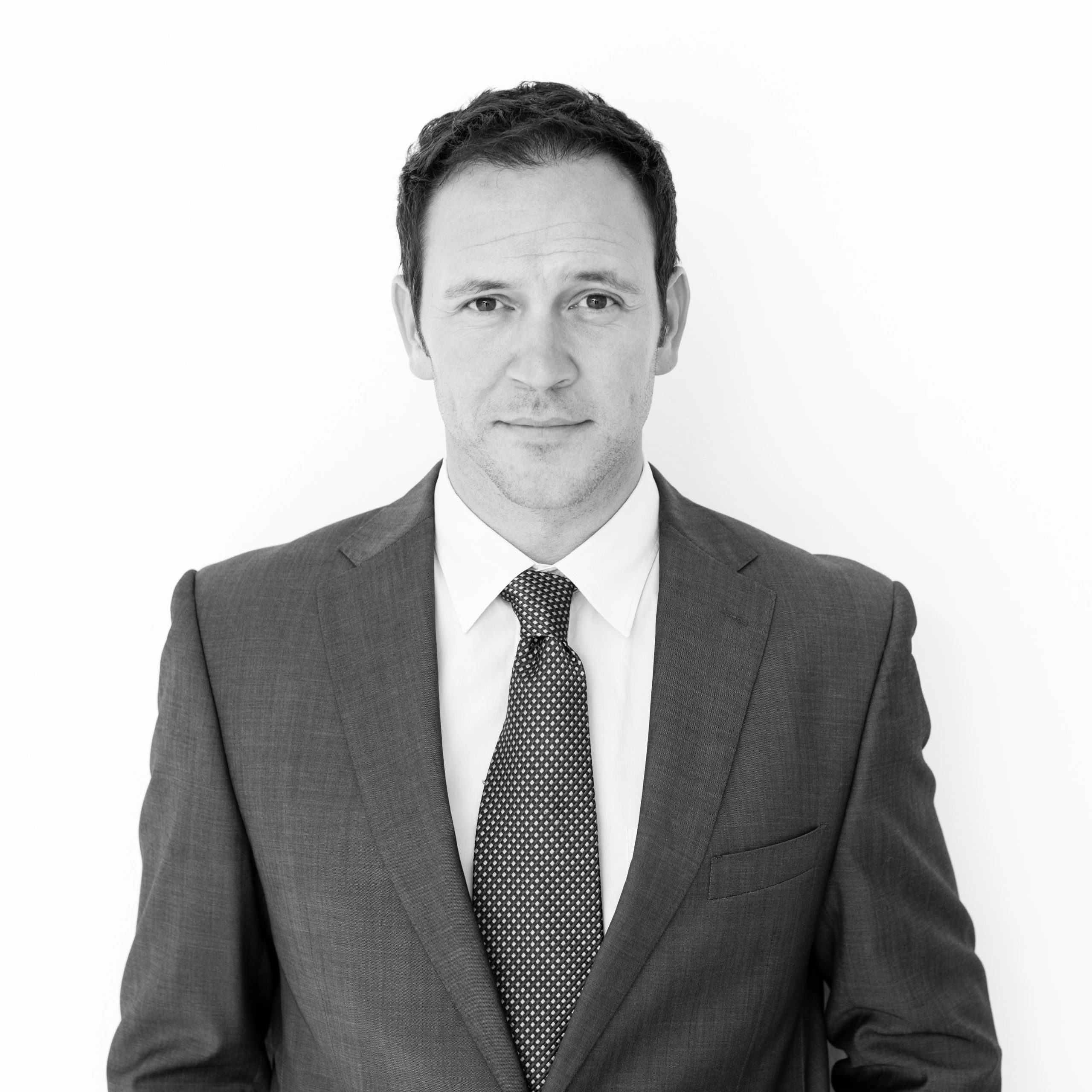 Professional headshot of a procurement lead